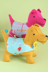 2 felt dogs in coats