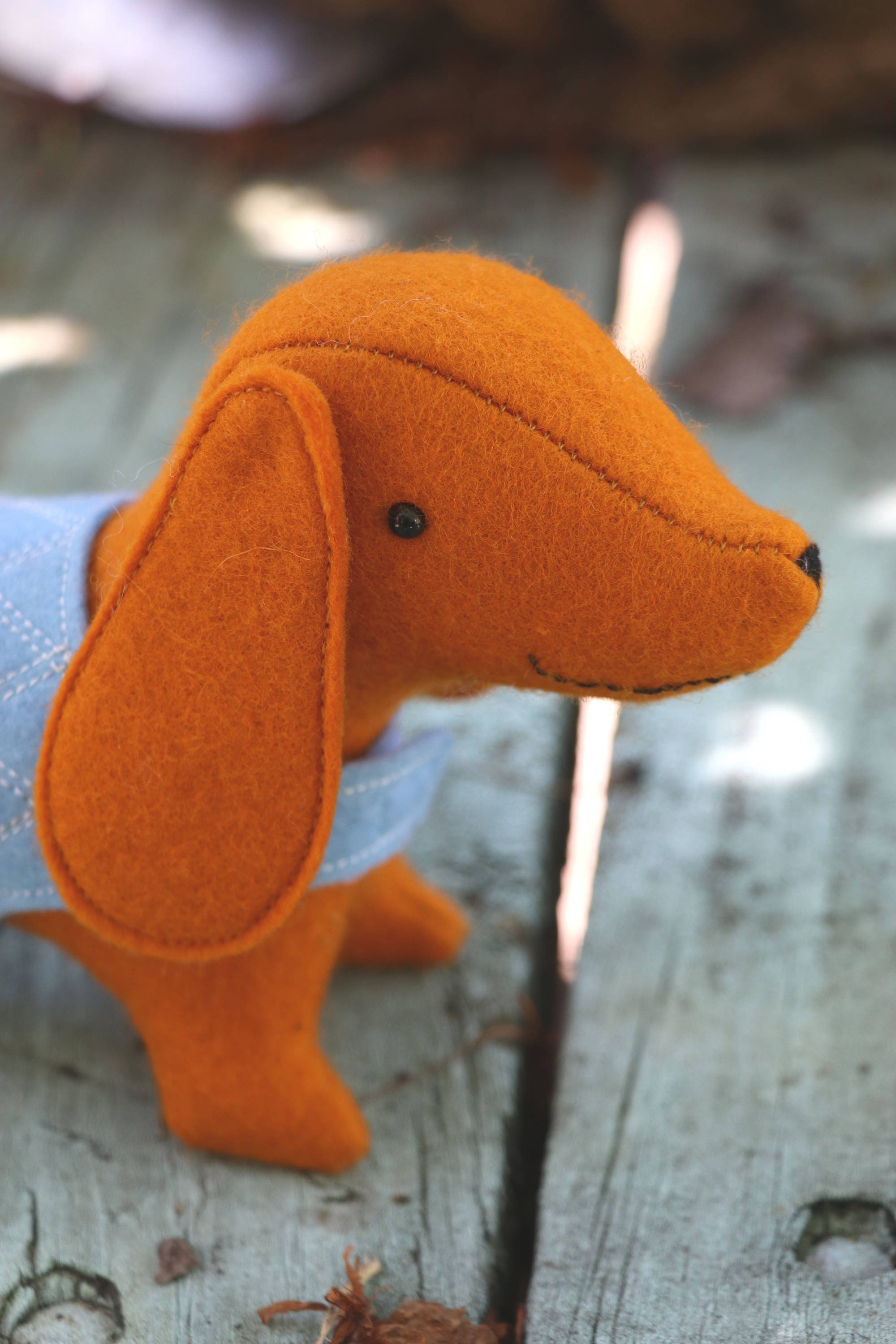 close up of felt sausage dog face