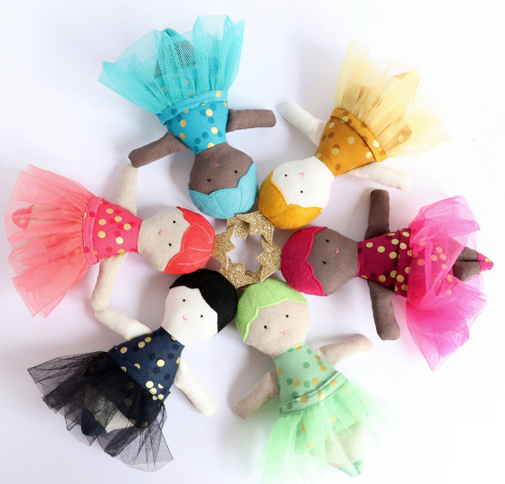 6 small dolls wearing tutus