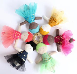 6 small dolls wearing tutus