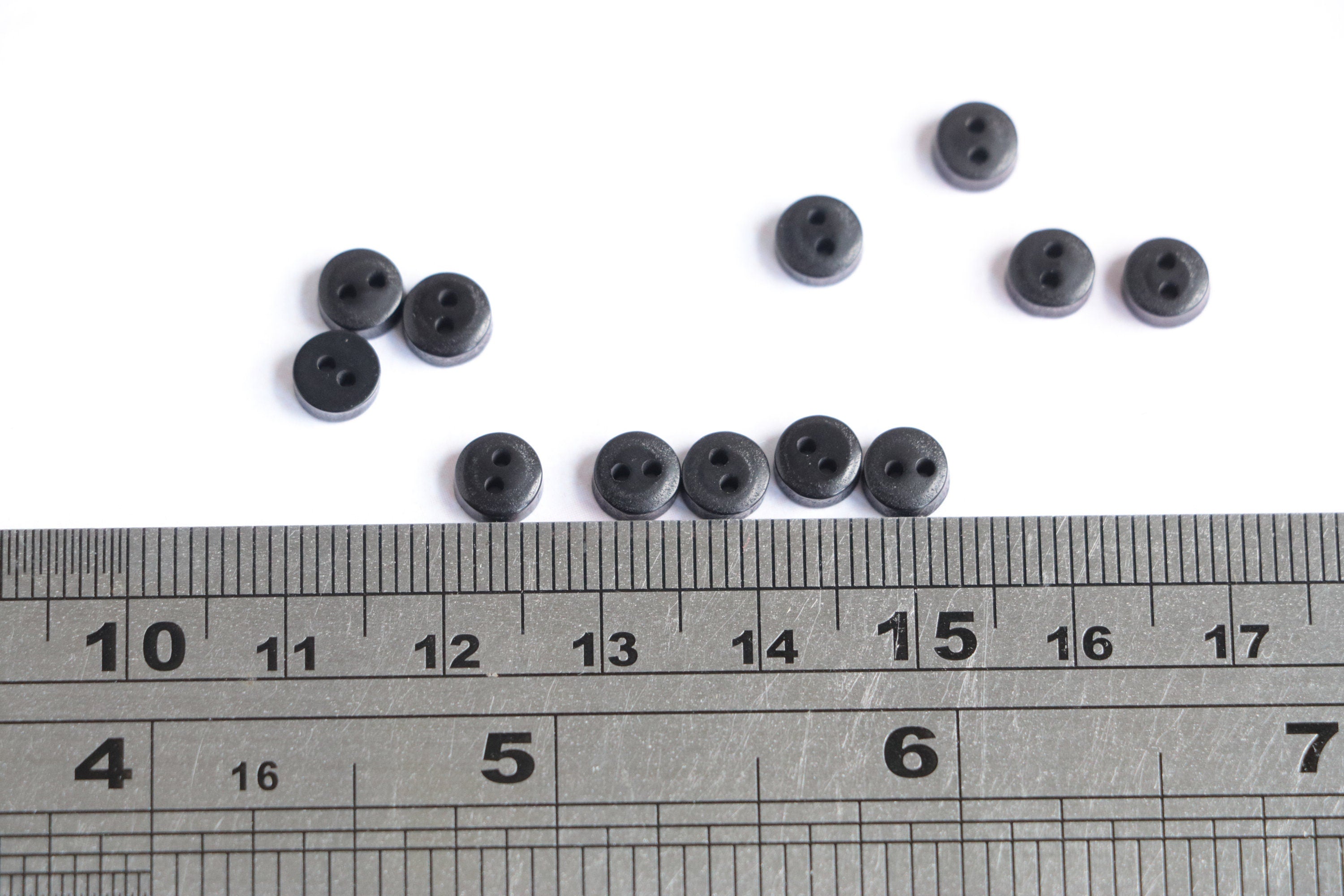 Black doll clothes buttons.